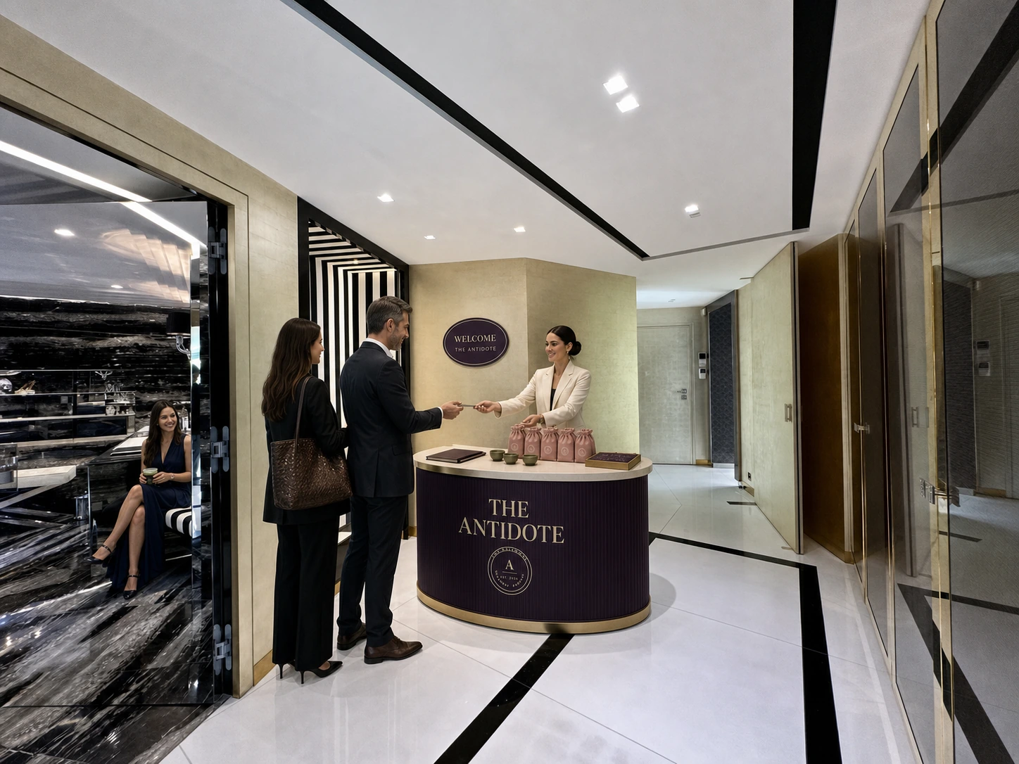 Guests checking in at a softly branded Antidote concierge desk inside the Cannes apartment.